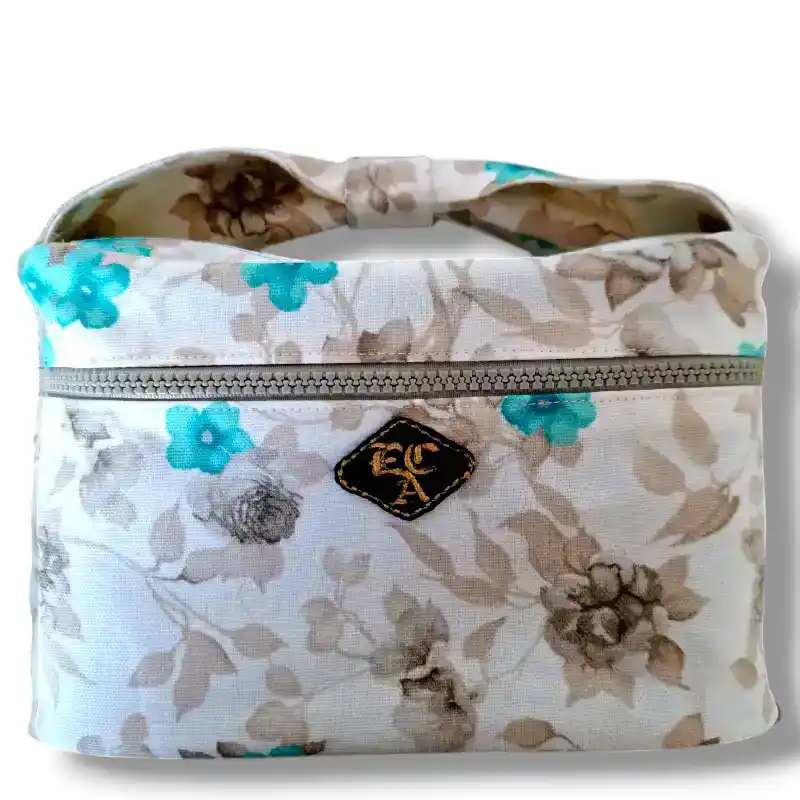 beauty case in tessuto impermeabile con impugnatura a fiocco